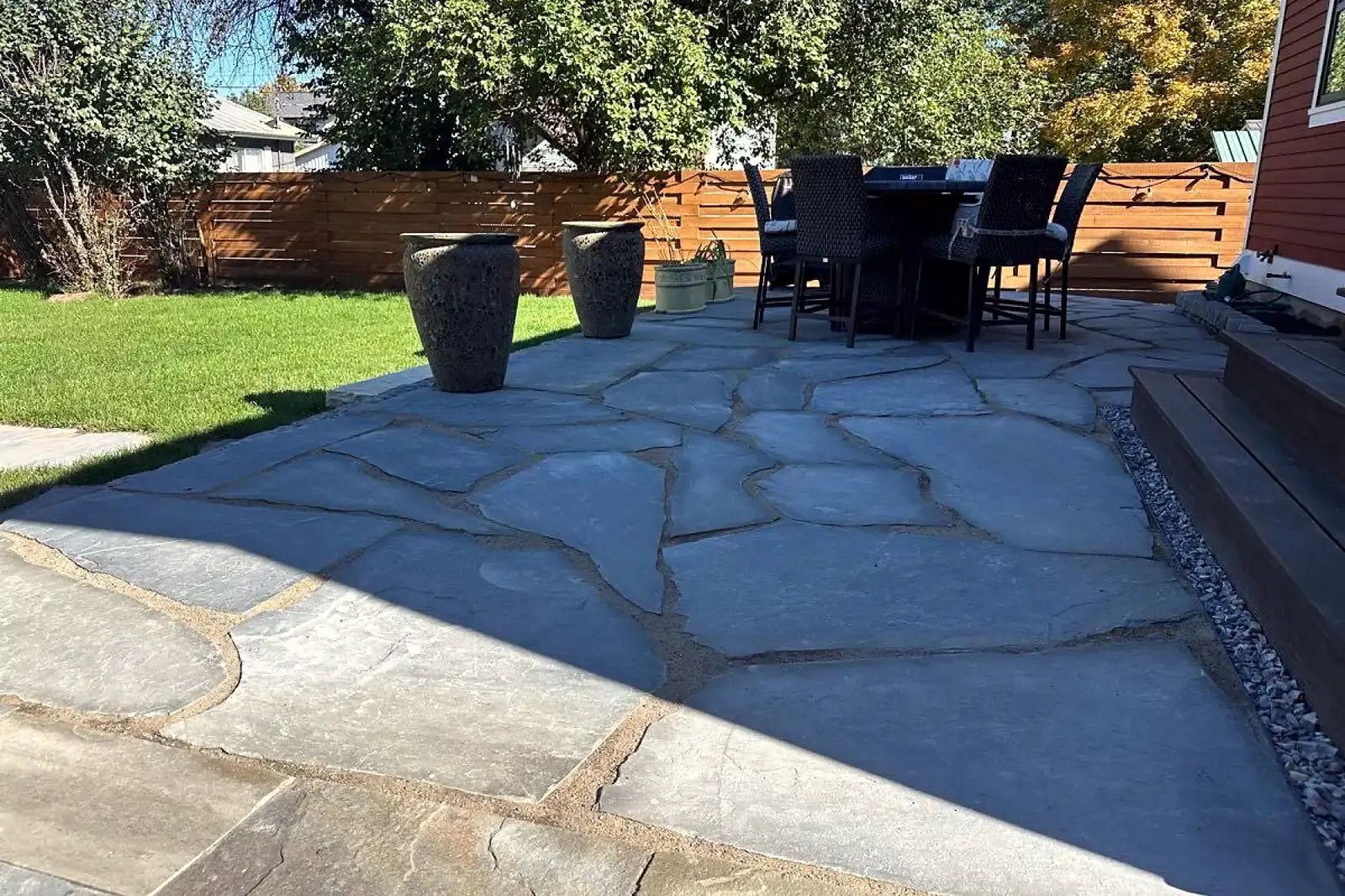 Flagstone patio with outdoor dining set