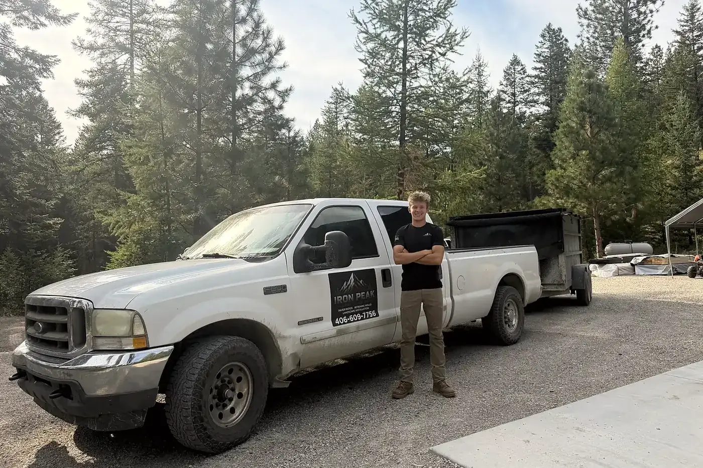 Sawyer and the Iron Peak Landscaping truck on site