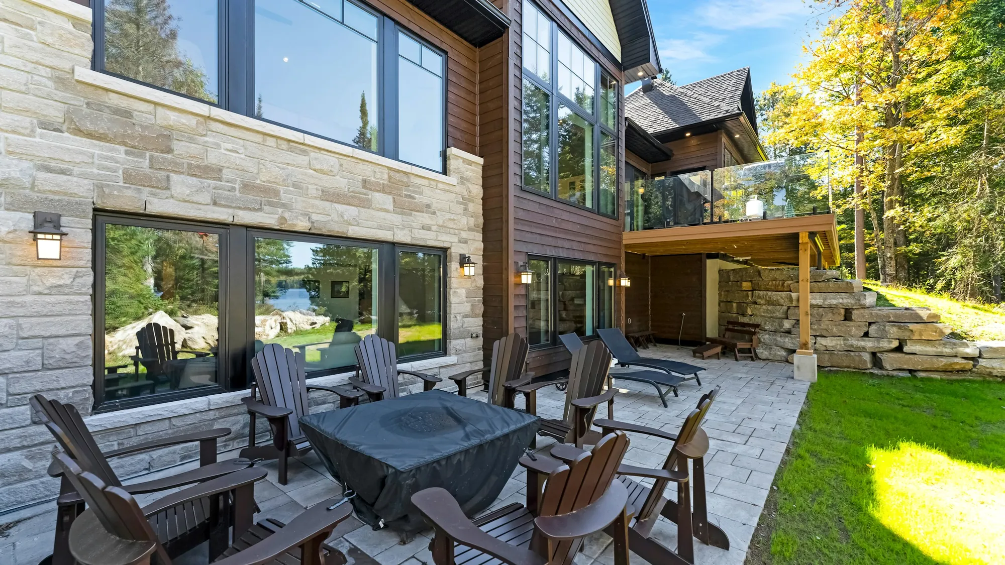 Modern home with paver terrace and outdoor furniture